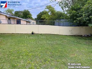 Beige fence privacy nets fix on yard fence-9